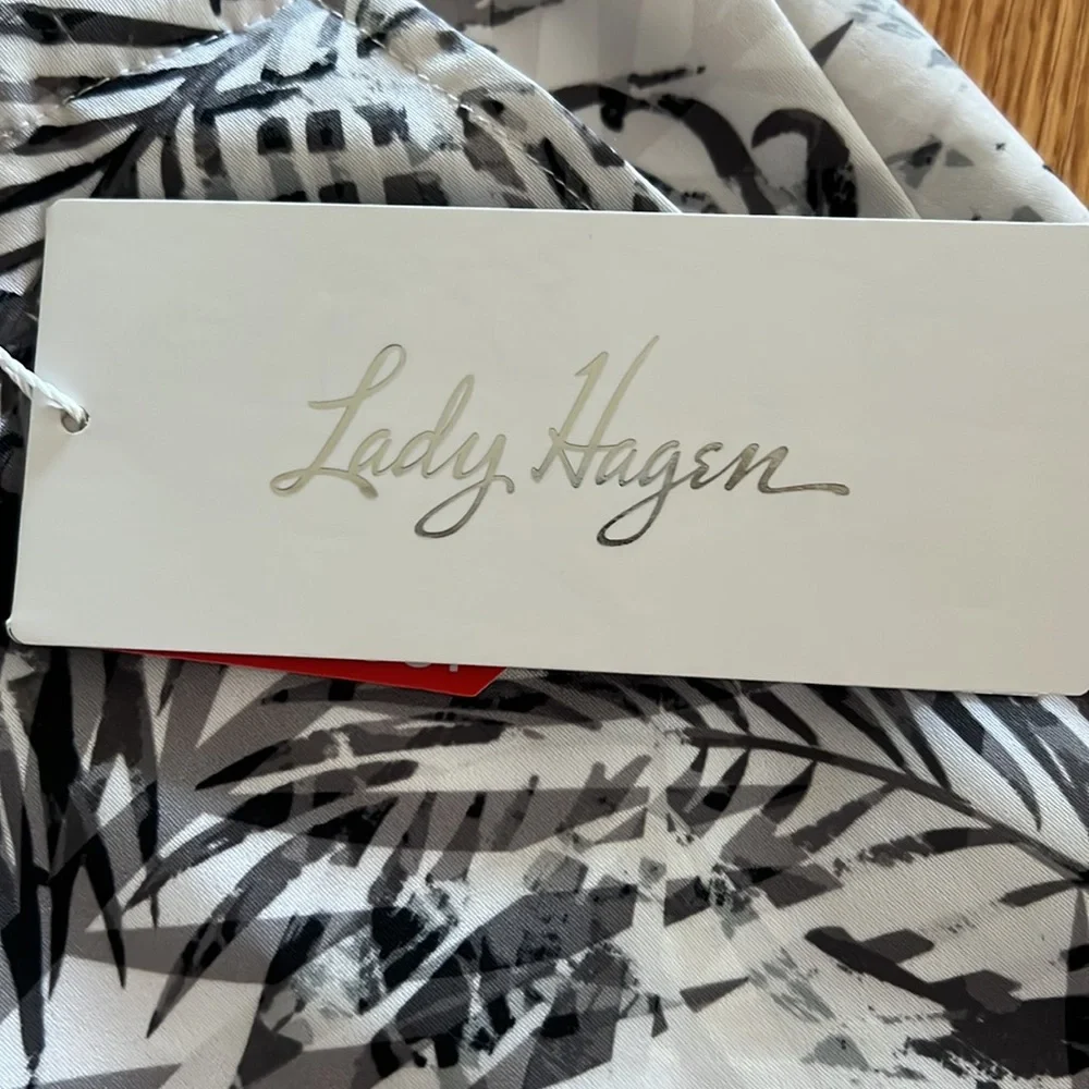 ONE BRAND NEW SKORT AND ONE PAIR OF SHORTS - Picture 3 of 9